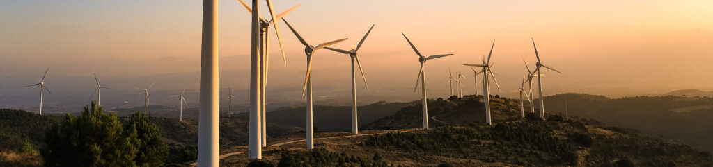 Wind farm in Navarre, Spain at sunset. Renewable energy concept.